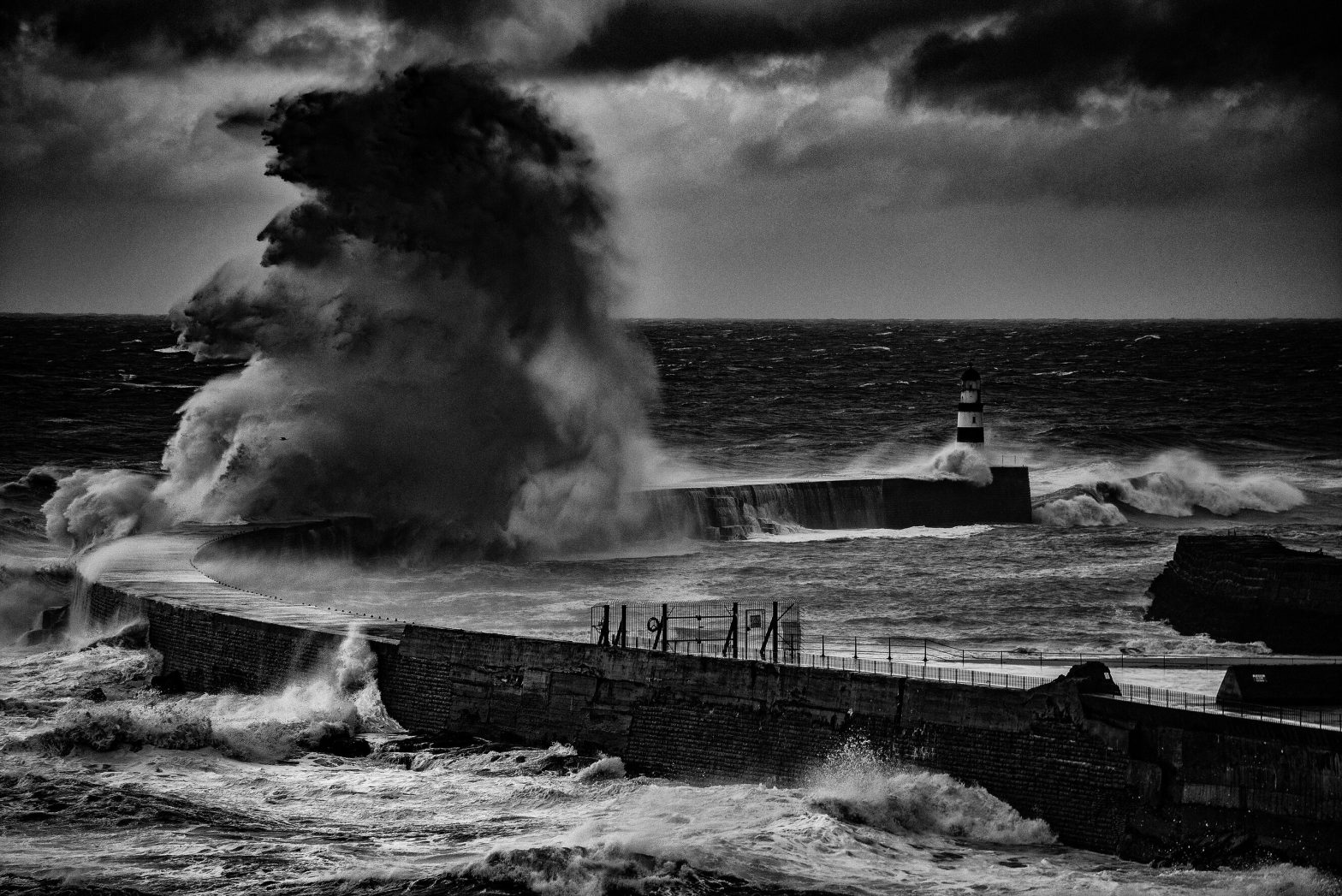 An image of a stormy sea with a massive sea spray.